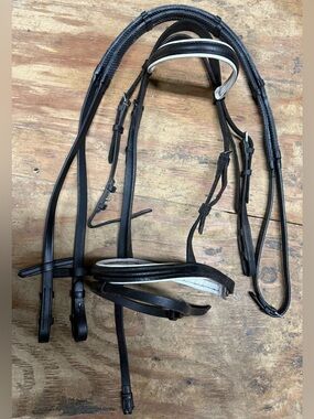 Black and white pony bridle and reins